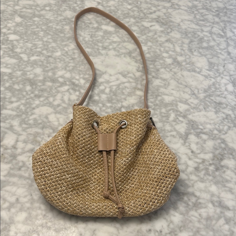 Neutral Tan Straw Drawstring Crossbody Bag with Leather Trim